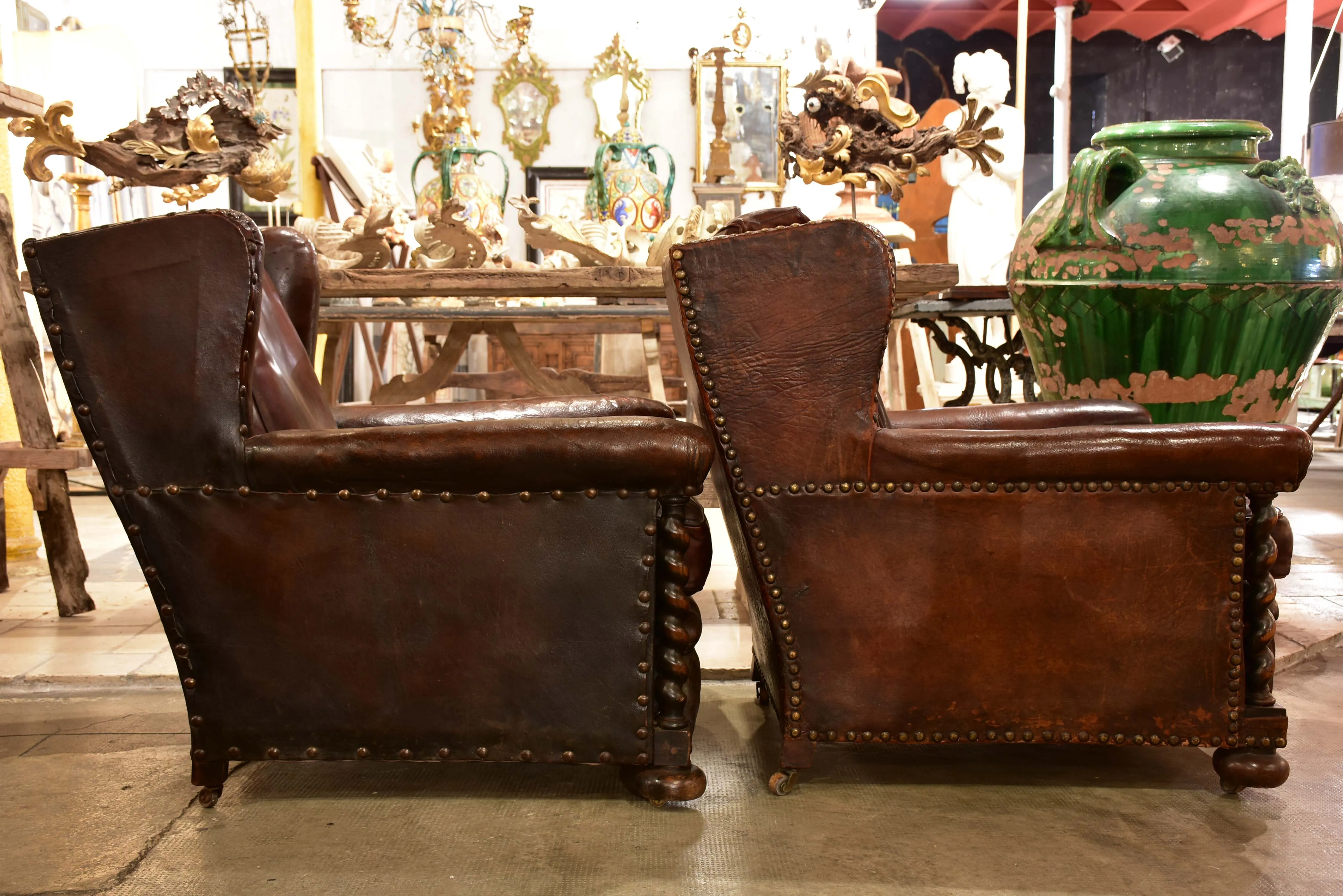 False pair of vintage French wingback club chairs